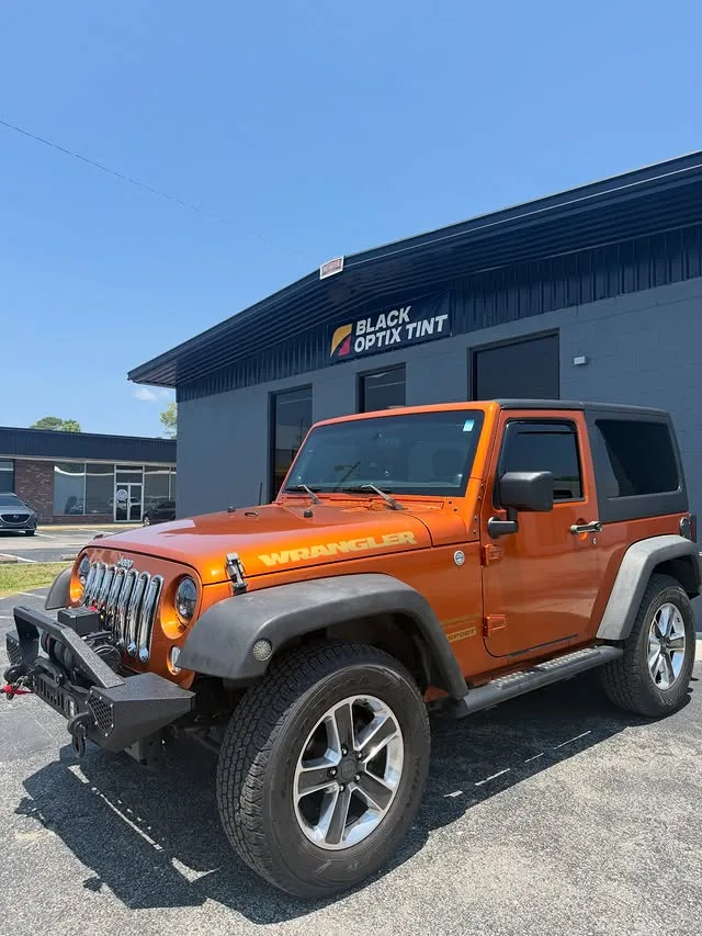 Orange Jeep Wrangler with 20% ceramic tint all around